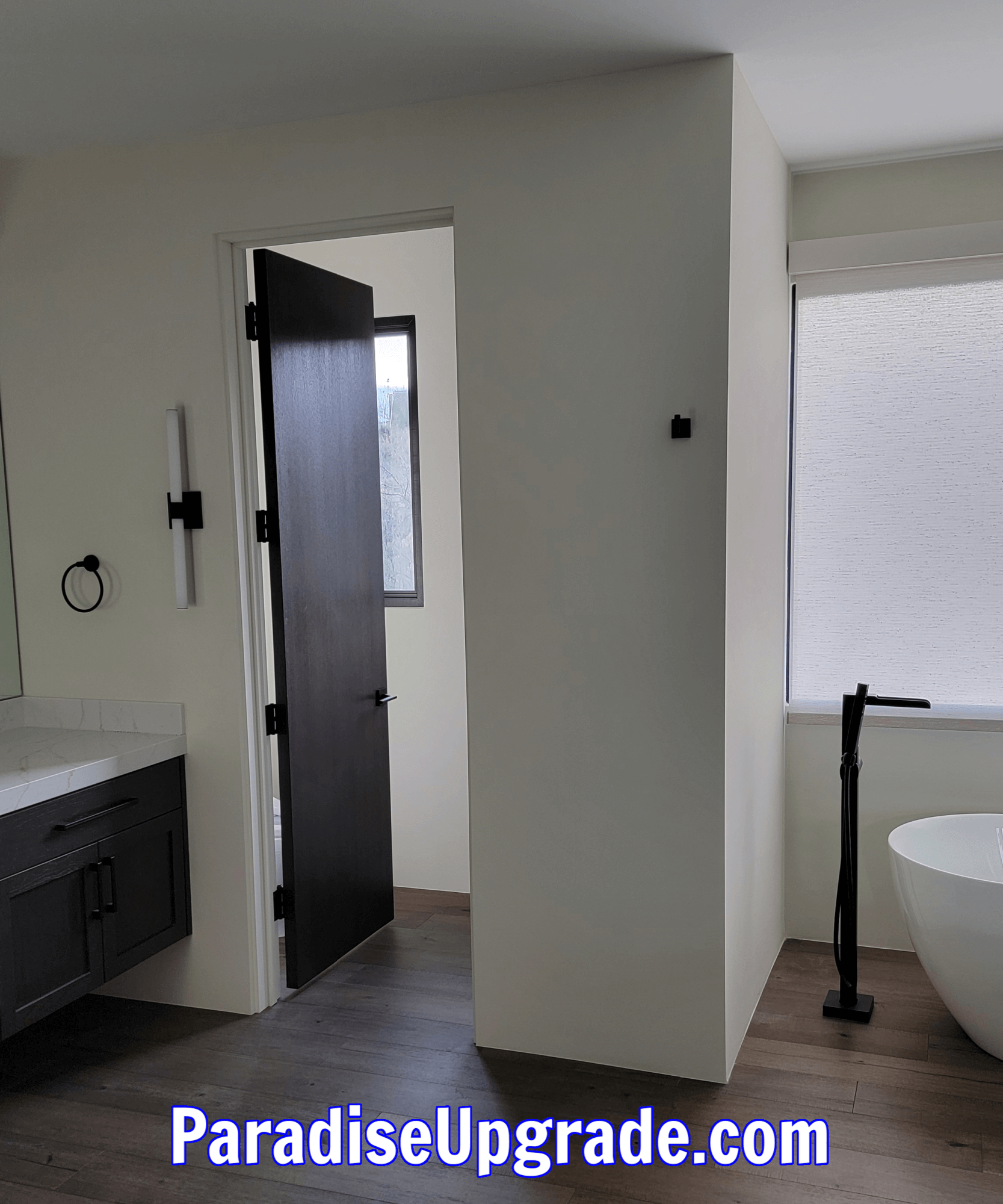 Door moved to new location and project is complete. Door now swings left and the electrical has been moved to the right side for easy reach.