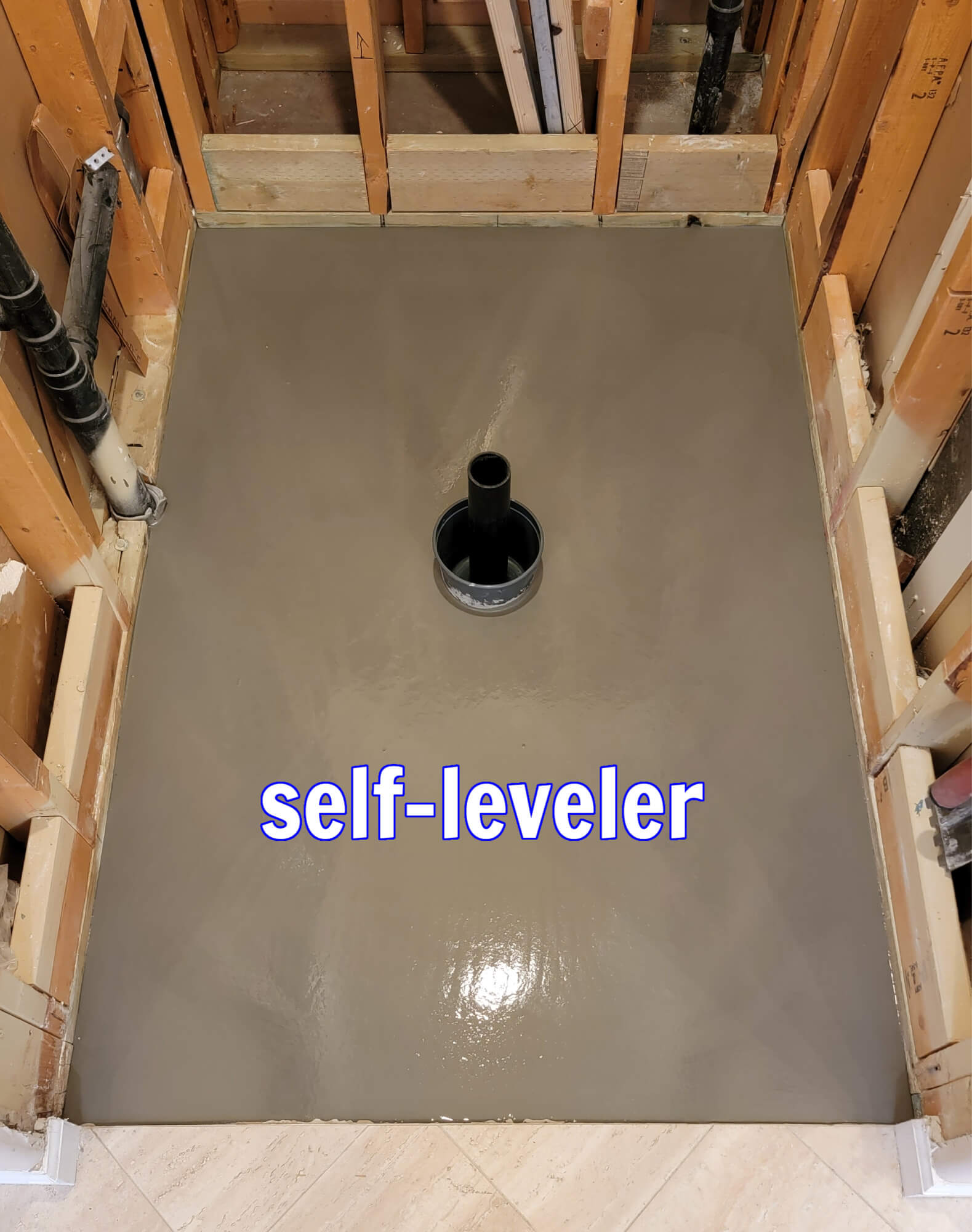 Self-leveler applied on concrete shower floor. Self-leveler applied on concrete shower floor.