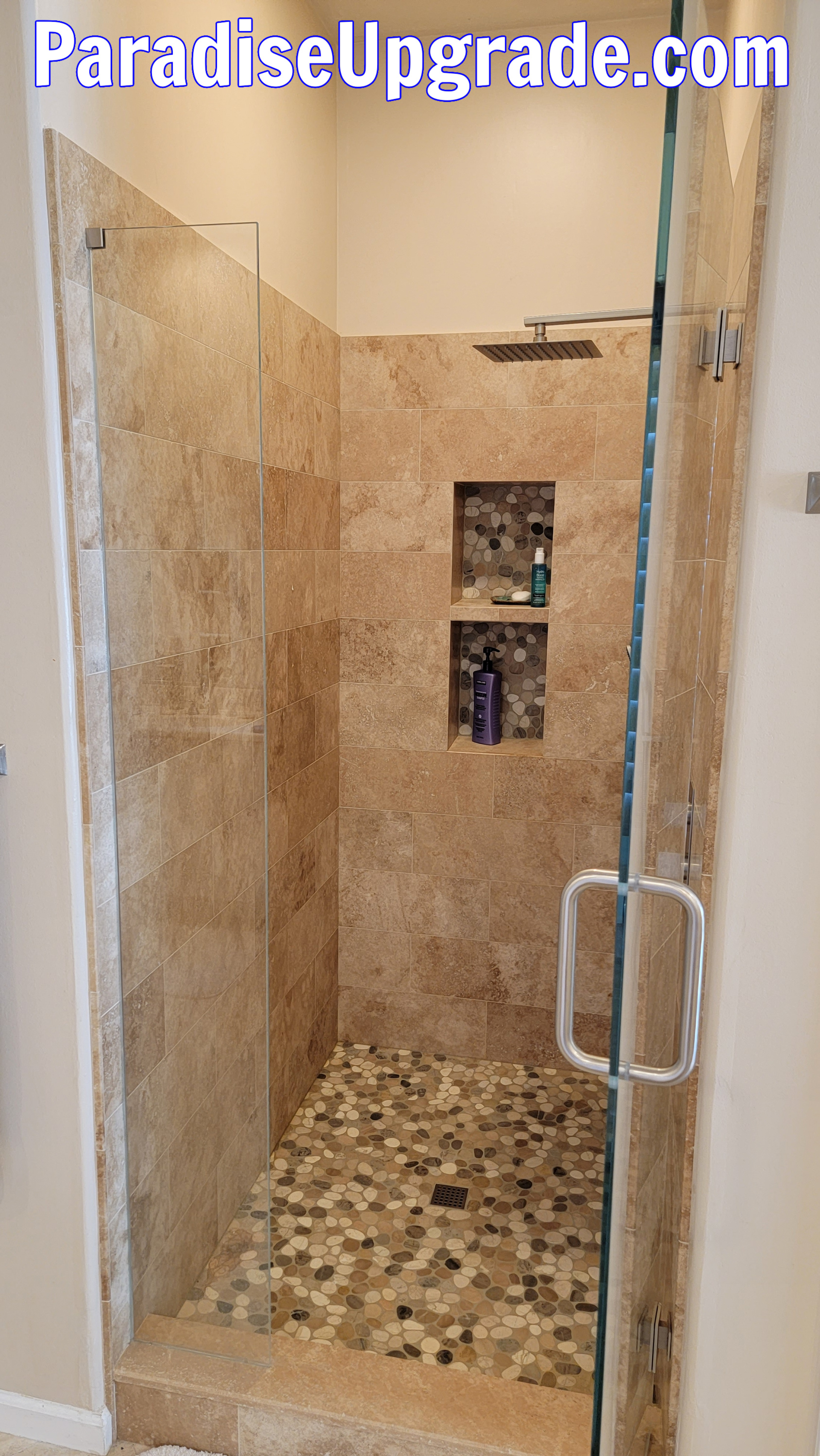 Shower glass door and panel installed. Shower glass door and panel installed.